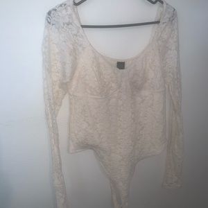 Women’s high white bodysuit. Snap bodysuit with lace arms, built in bra wiring.